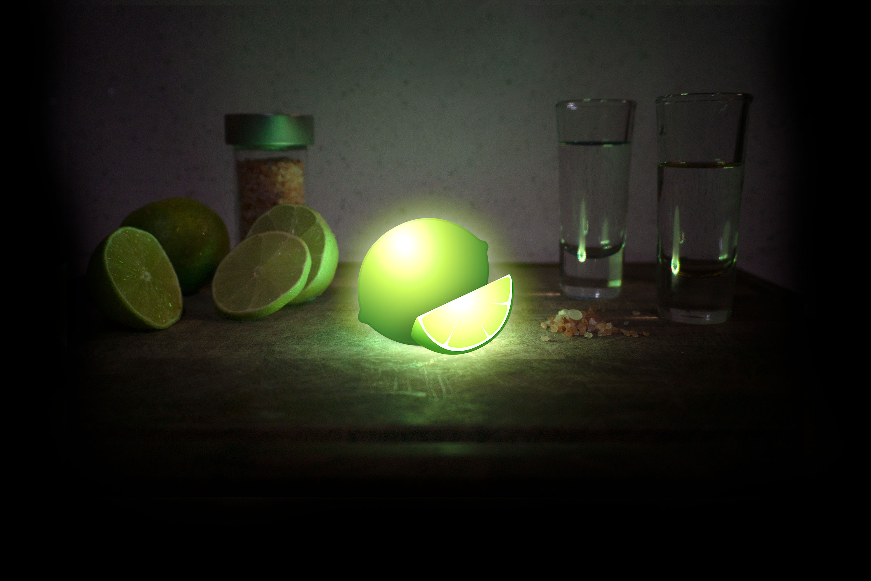 Lime emoji one cutting board in dark room with shot glasses and sliced fruit